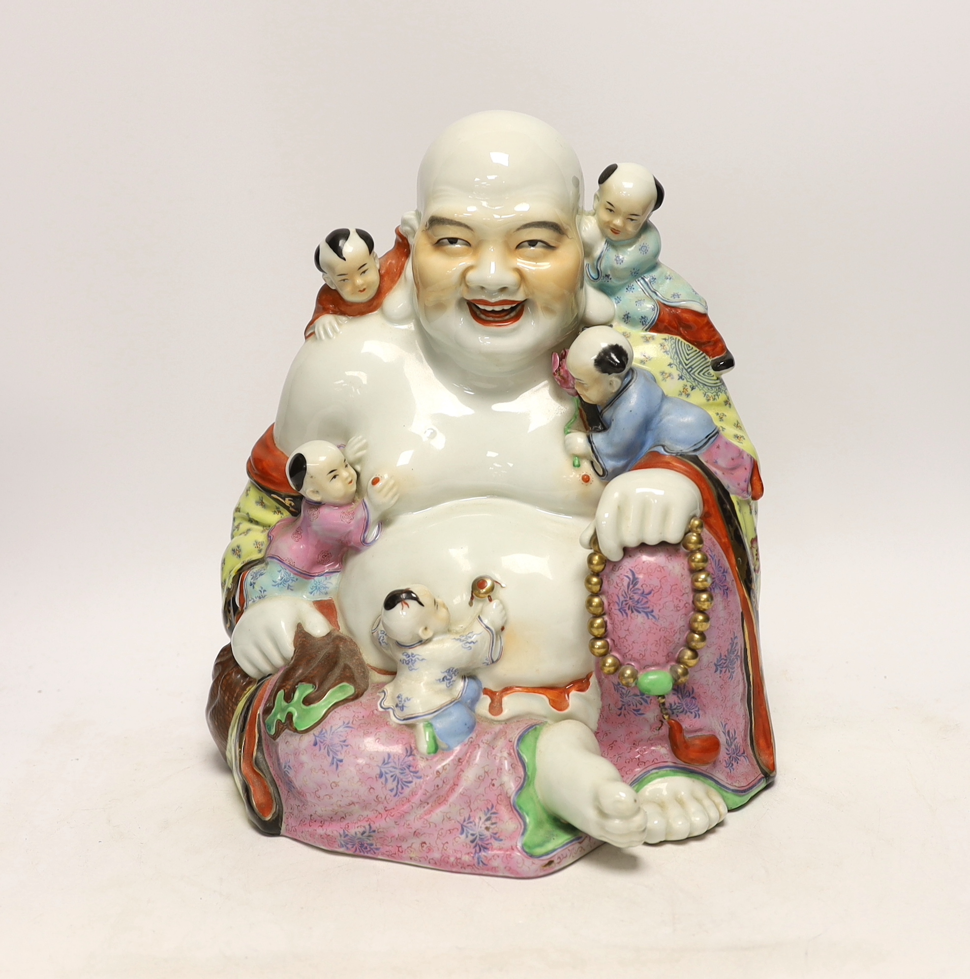 A Chinese enamelled porcelain group of laughing Budai with children, mid 20th century, 31cm high